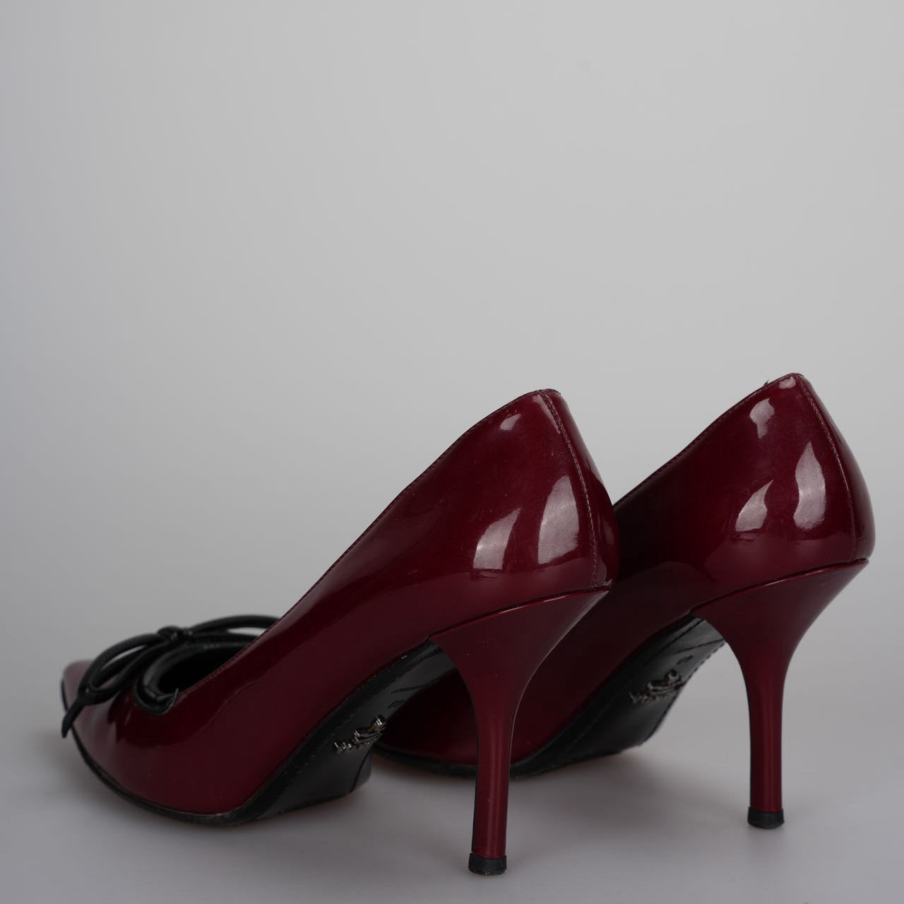 Prada Burgundy Patent Pointed Toe Bow Pumps 40