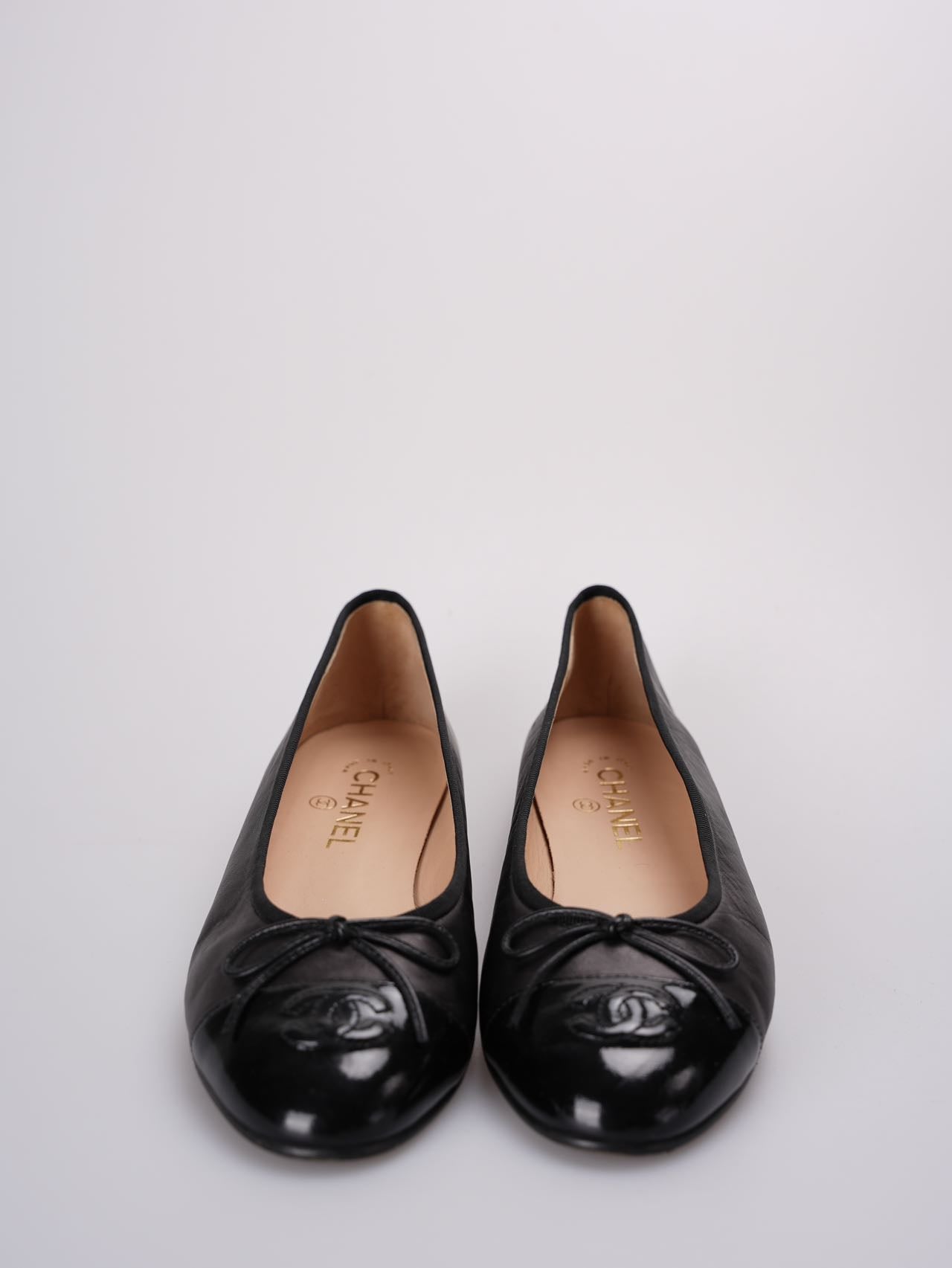 Chanel ballet flats in black leather with contrasting black patent toe and embossed interlaced Chanel C logo size 40